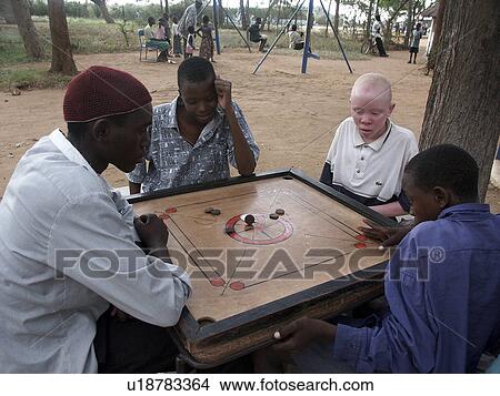 Picture - playing, sport, boys, tanzania, person, people. Fotosearch