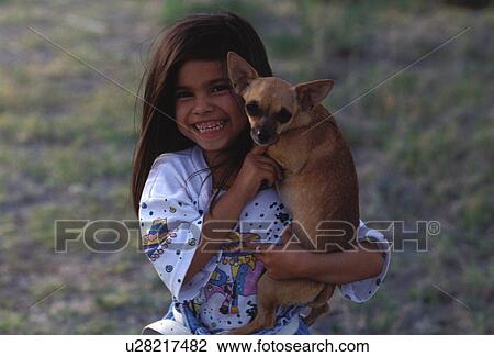 Stock Image - portrait, released, dog, girl, hispanic, model. Fotosearch