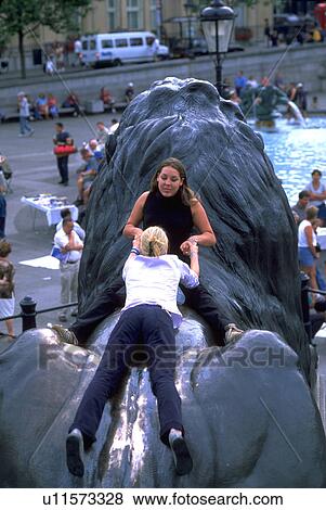 sitting, trafalgar, playing, girls, square, sport View Large Photo Image Stock Photo - sitting, trafalgar, playing, girls, square, sport. Fotosearch