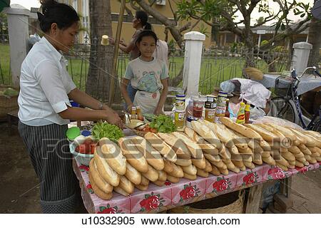Stock Photography - stall, people, sandwich, laos, person, food. Fotosearch
