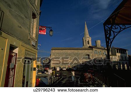 Stock Image - street, female, shadowy, through, walking, woman. Fotosearch