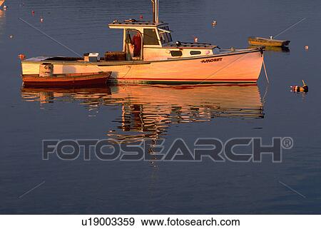 Stock Photo - tranquil, boats, blue, ocean, reflections, water. Fotosearch