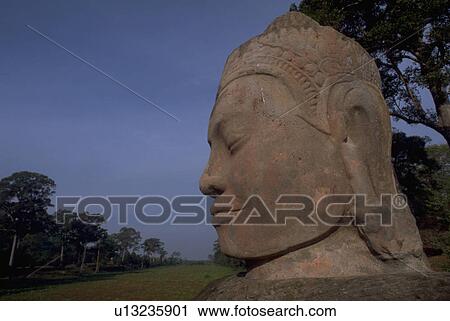 Stock Image - trees, buddha, field, grassy, closeup, carved. Fotosearch