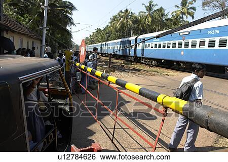 Stock Photograph - varkala, person, crossing, railway, india, people. Fotosearch