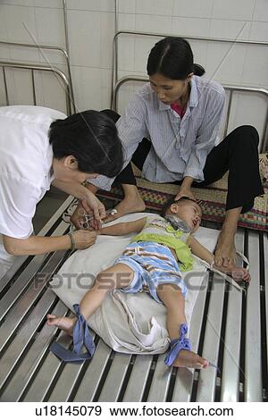 Stock Photo - vietnam, hand, kid, person, child, people. Fotosearch