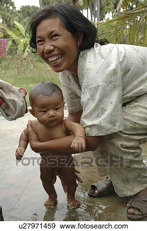 washing, people, cambodia, person, child, woman View Large Photo Image Stock Photo - washing, people, cambodia, person, child, woman. Fotosearch