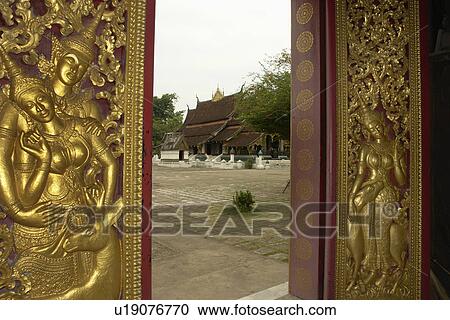 Stock Image - wat, person, doors, ornate, laos, people. Fotosearch