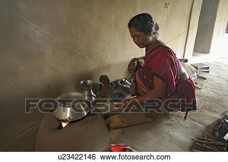 Stock Photograph - women, food, fire, person, people, woman. Fotosearch