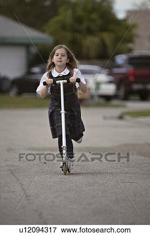 Stock Photo - active, scooter, usa, florida, scenic, girl. Fotosearch