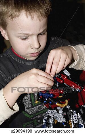 Stock Photo - age, bionicle, lego, building, boy. Fotosearch