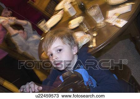 Stock Image - age, dinner, out, looking, boy. Fotosearch