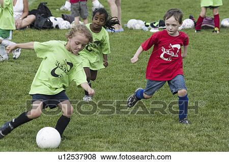Stock Photo - age, girls, game, soccer, boys, feisty. Fotosearch
