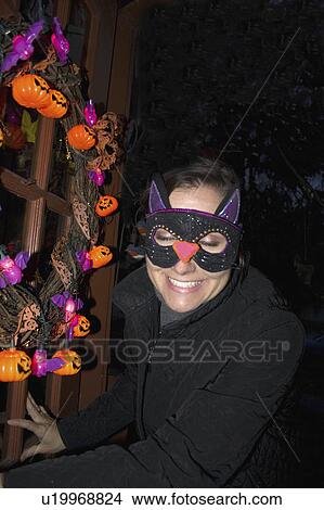 Picture - age, halloween, cat, treating, trick, masked. Fotosearch