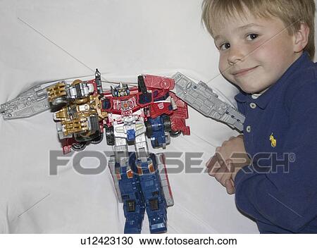 Stock Image - age, transformer, displaying, pridefully, boy. Fotosearch