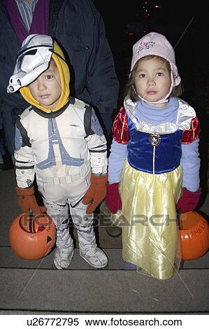 Stock Photography - age, trick, spacesuits, dressed, treaters, halloween. Fotosearch