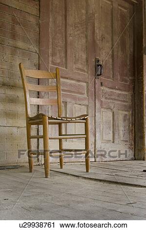 Stock Image - aged, old, wood, antique, porch, chair. Fotosearch