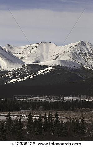 Stock Photograph - alberta, covered, rocky, winter, mountains, snow. Fotosearch