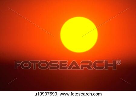 Stock Photo - august, globe, sunset, sun, setting, golden. Fotosearch
