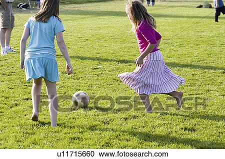Stock Image - barefooted, age, soccer, playing, 11, girls. Fotosearch
