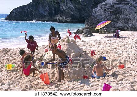 Stock Image - bay, children, horseshoe, family, kids, sandcastles. Fotosearch