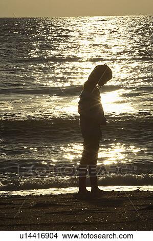 Picture - beach, girl, surf, through, walking, young. Fotosearch