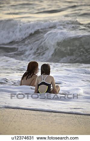 beach, young, surf, enjoying, girls, two View Large Photo Image Stock Image - beach, young, surf, enjoying, girls, two. Fotosearch
