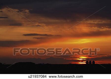 Picture - behind, sun, clouds, up, lighting, setting. Fotosearch