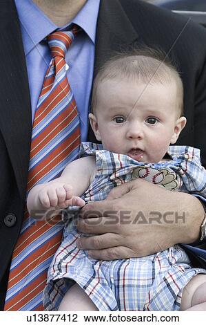 Stock Image - boy, age, baby, holding, 37, businessman. Fotosearch