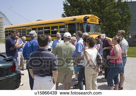 Stock Photo - bus, reunion, outside, group, tour, family. Fotosearch