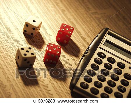 Stock Image - calculator, financial, finance, newspaper, dice. Fotosearch