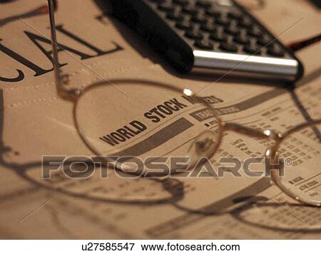 Stock Photo - calculator, financial, finance, newspaper, spectacles. Fotosearch