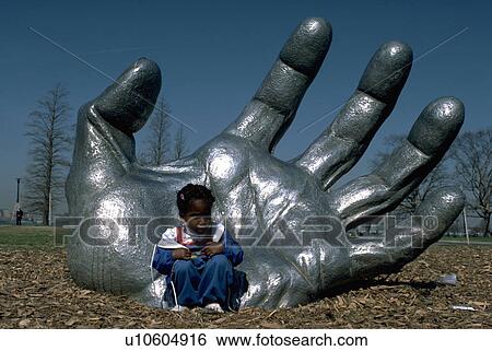 Stock Photograph - child, awakening, american, african, statue, hand. Fotosearch