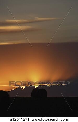 clouds, sun, storm, out, peaking, setting View Large Photo Image Stock Image - clouds, sun, storm, out, peaking, setting. Fotosearch