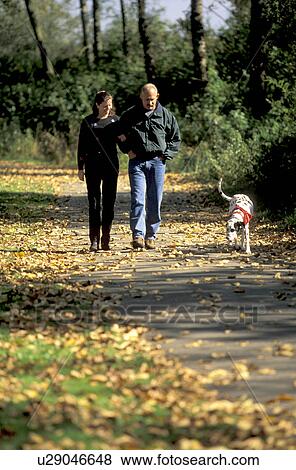 Stock Photo - couple, road, lowell, dog, peaceful, wa. Fotosearch