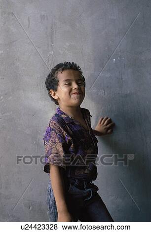 Stock Photo - coy, hispanic, kid, child, boy, mexican. Fotosearch