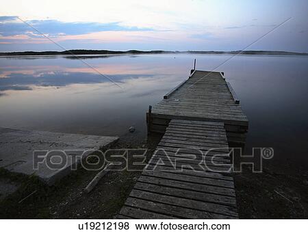 Stock Photo - dock, scenic, lake, smallfish, boat. Fotosearch