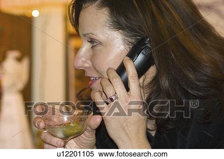 Stock Photography - drinking, female, phone, 38, age, woman. Fotosearch