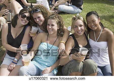 Stock Image - drinking, females, fun, having, friends, women. Fotosearch
