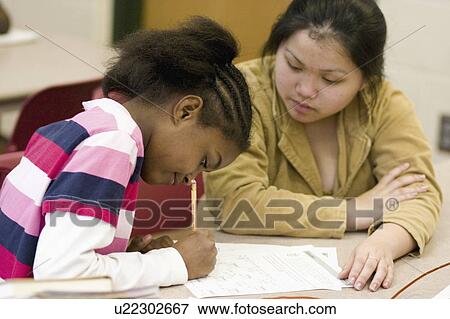 Stock Photo - express, working, youth, studies, student, tutor. Fotosearch