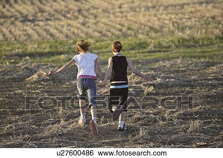 field, poung, together, running, girls, two View Large Photo Image Stock Photograph - field, poung, together, running, girls, two. Fotosearch