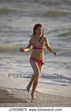 Stock Image - florida, girl, beach, down, running, young. Fotosearch