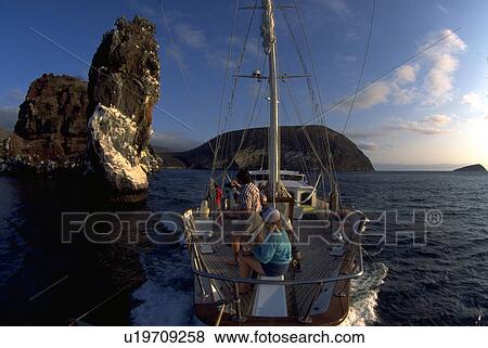 Stock Photo - galapagos, rock, vessel, small, cliff, view. Fotosearch
