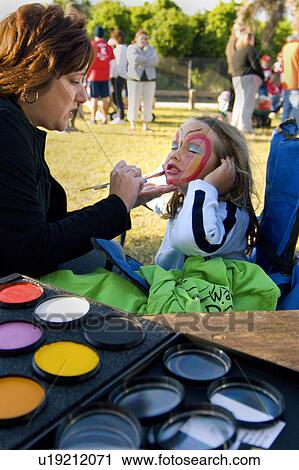Stock Image - girl, makeup, artist, painting. Fotosearch