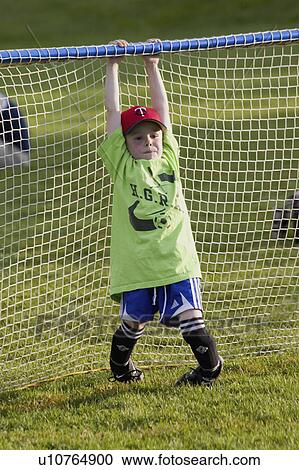 Stock Image - goalie, net, hanging, age, soccer. Fotosearch