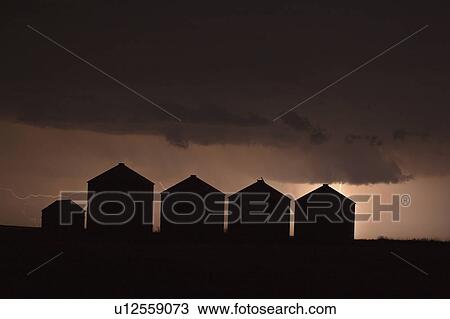 Stock Image - grain, storm, behind, lightning, clouds, dark. Fotosearch