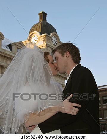 Stock Image - groom, front, street, main, bride. Fotosearch