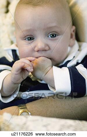 Stock Photograph - infant, mothers, grip, secure, month. Fotosearch