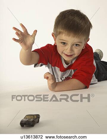 Stock Image - jaw, playing, moose, car, toy, boy. Fotosearch