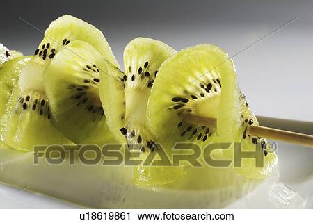 Stock Image - kiwi, fruit, background, white, skewer. Fotosearch