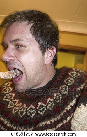 Stock Photo - male, bite, big, taking, hungry. Fotosearch